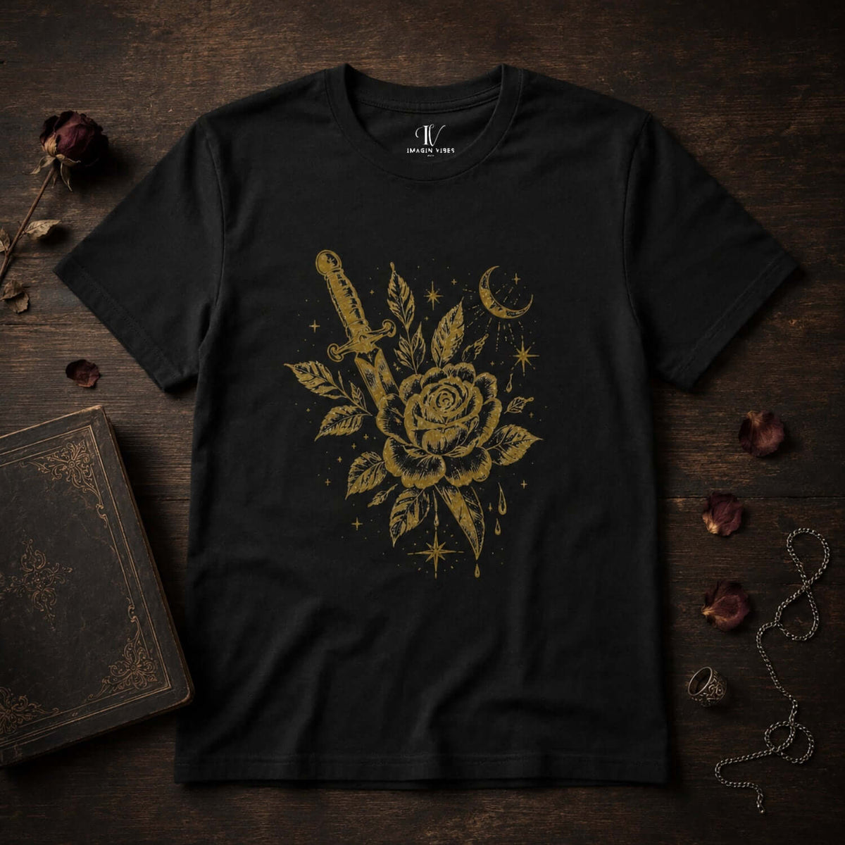 Dark romantic graphic tee featuring a distressed gold rose and dagger design on a soft black shirt.