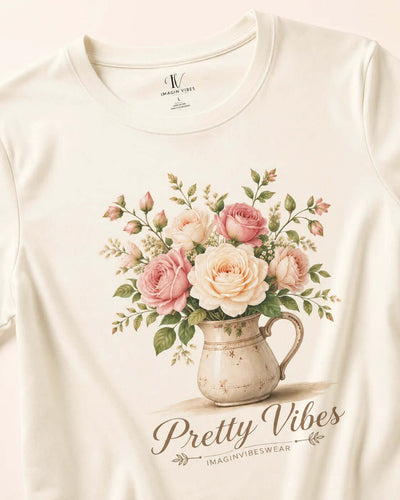 Pretty Vibes floral tee featuring a blush bouquet in a vintage pitcher, perfect for everyday fashion.